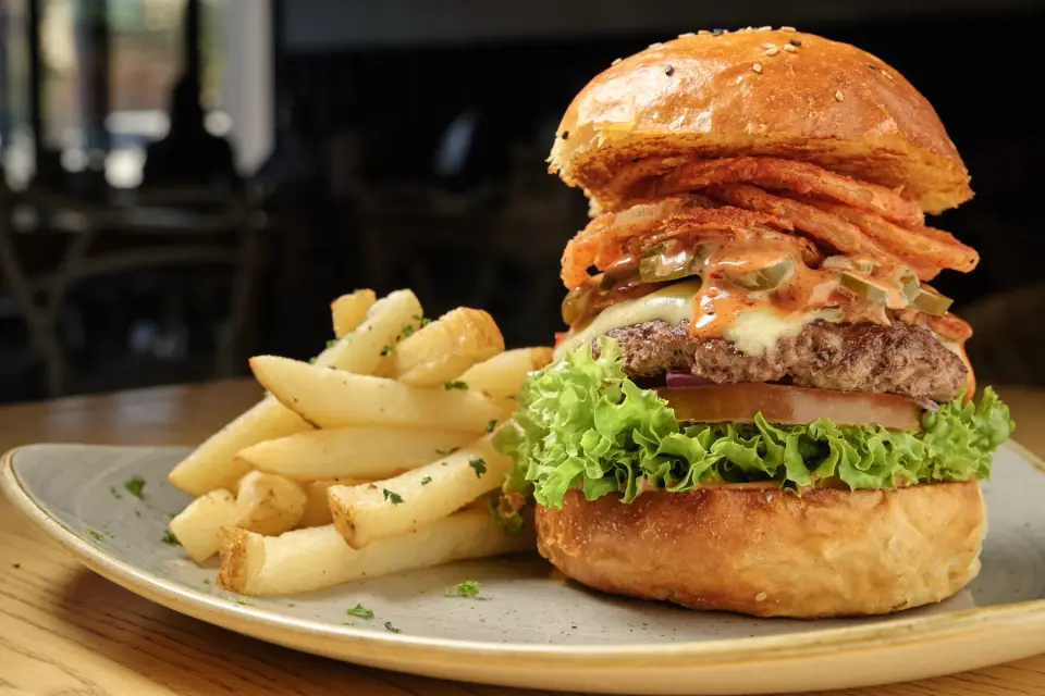 Loaded burger with chips on a plate